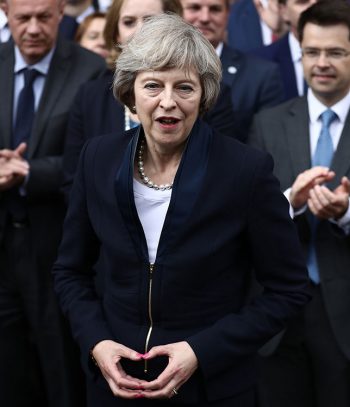 illuminati hand sign theresa may reversed pyramid