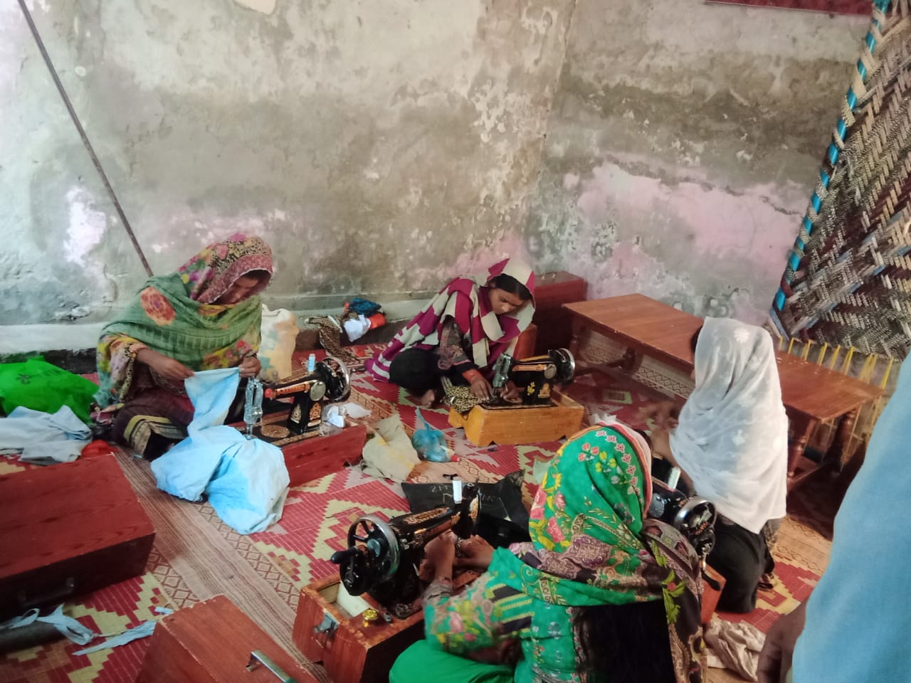 Women sewing on the floor

Description automatically generated